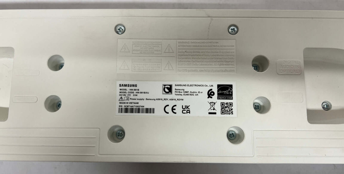Bottom view of SAMSUNG HW-S61B soundbar showing labels, connectors, and mounting holes.