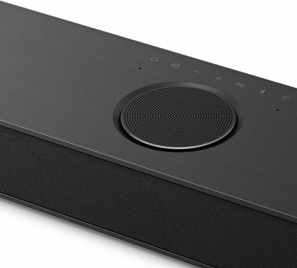 Close-up of the LG US80TR 5.1.3 wireless soundbar showcasing controls and sleek design for optimal audio experience.