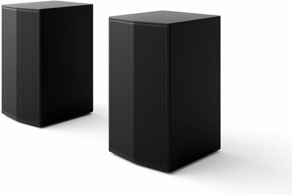 Pair of black wireless speakers designed for enhanced sound quality and Dolby Atmos compatibility.