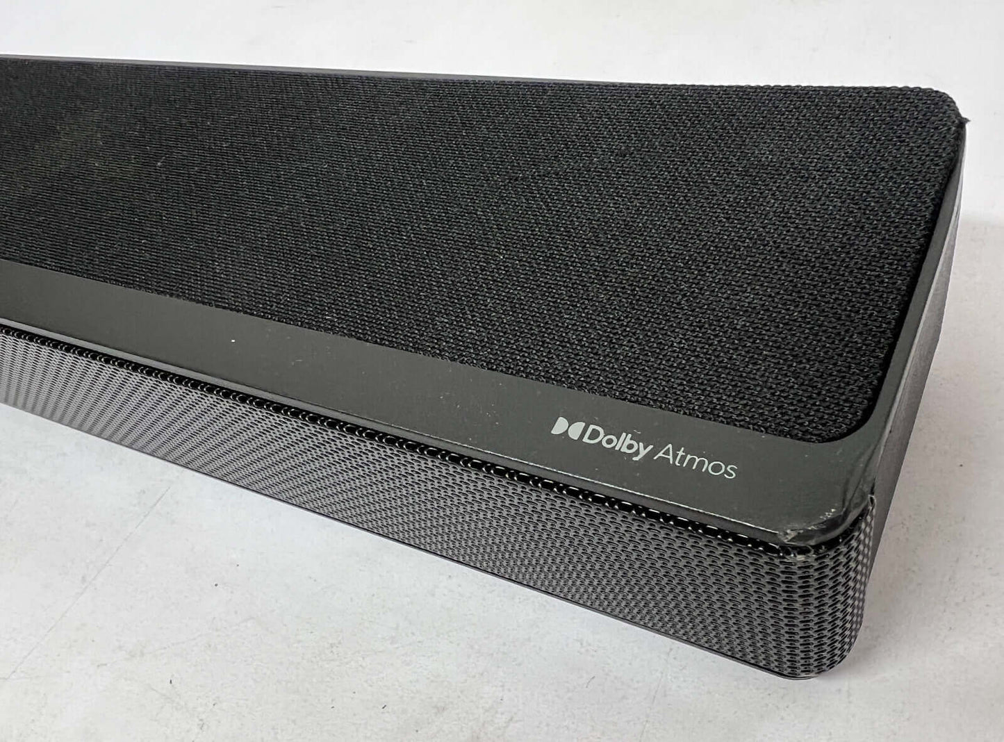 Close-up of Hisense AX3120G soundbar showing Dolby Atmos branding and sleek design.