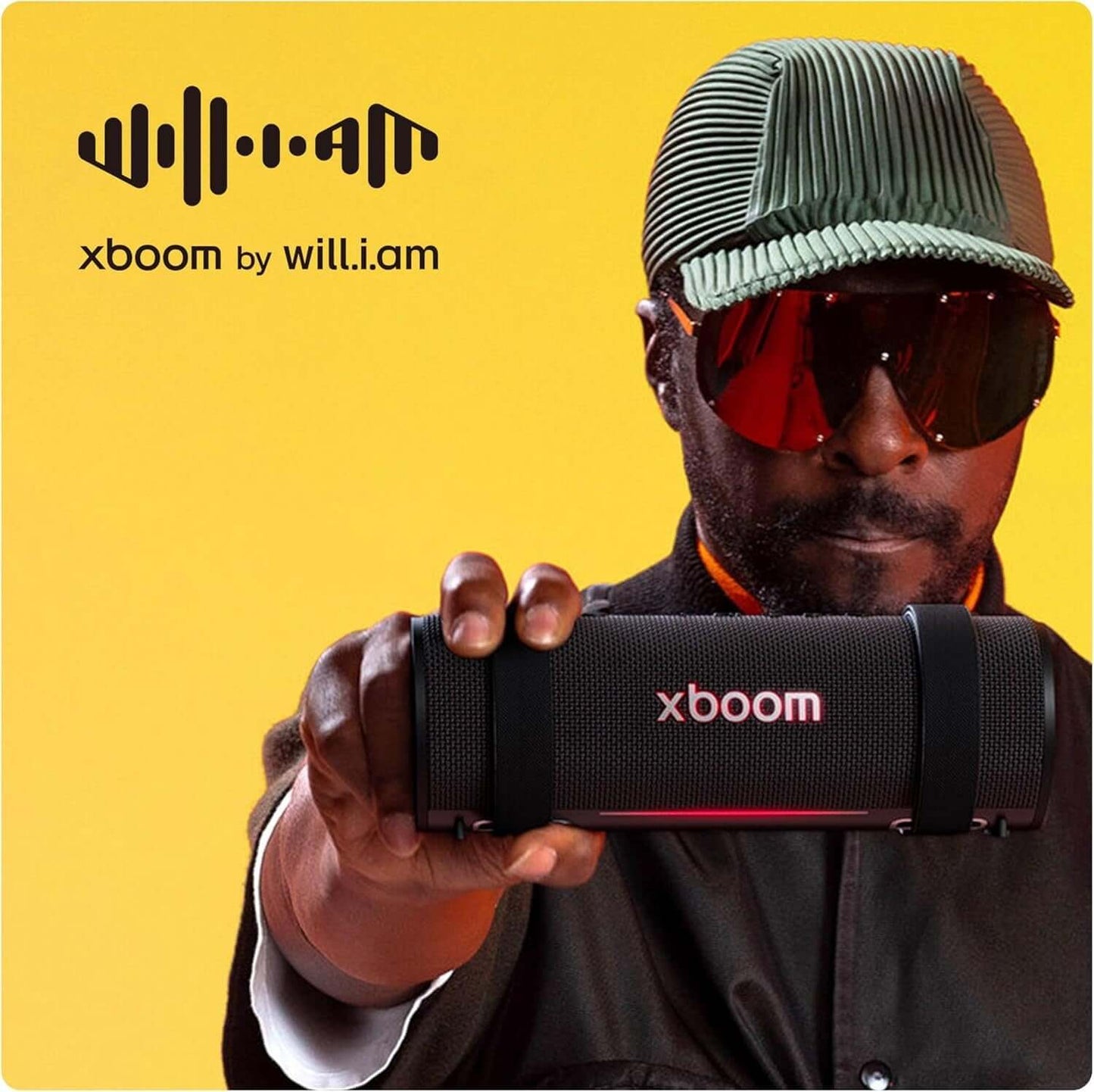 LG XBOOM Grab portable Bluetooth speaker showcased by a model, featuring a sleek black design and modern aesthetics.