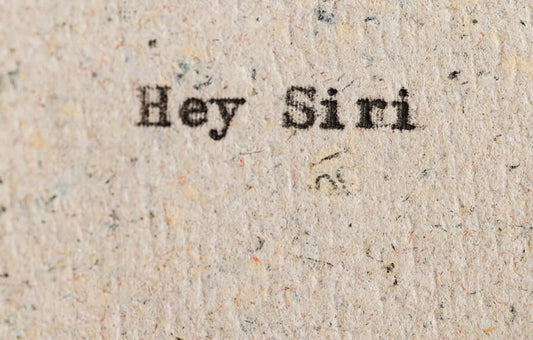 Hey Siri text on paper, symbolizing voice assistant technology in Comparing the Top Voice Assistants: Alexa, Siri, Google Assistant, and More.