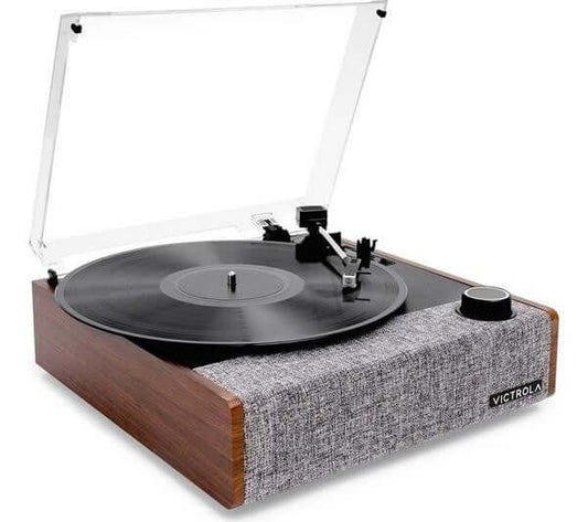 VICTROLA EASTWOOD II VTA-74 BELT DRIVE BLUETOOTH 5.1 VINYL TURNTABLE WALNUT on display with vinyl record playing.