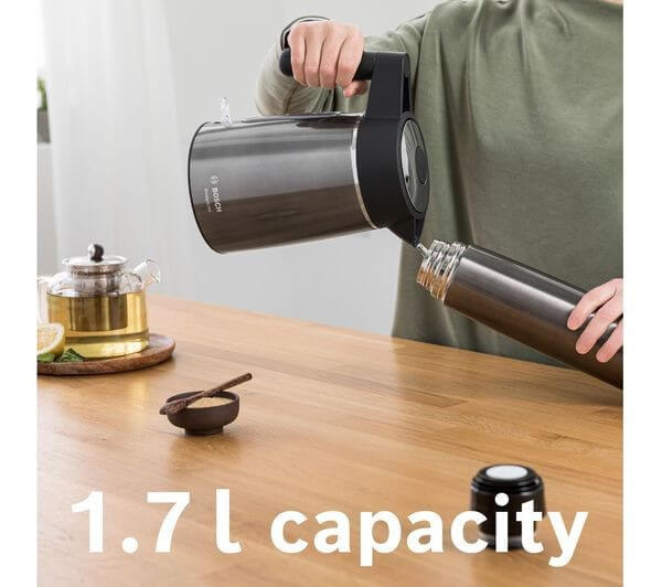 BOSCH DesignLine Ergo TWK5P475GB 3000W 1.7L JUG KETTLE BLACK & ANTHRACITE pouring water with 1.7L capacity indicator.