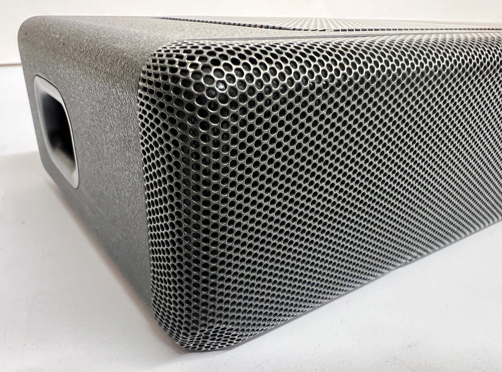 Close-up of SONY HT-A5000 soundbar showcasing its sleek metallic design and speaker grille.
