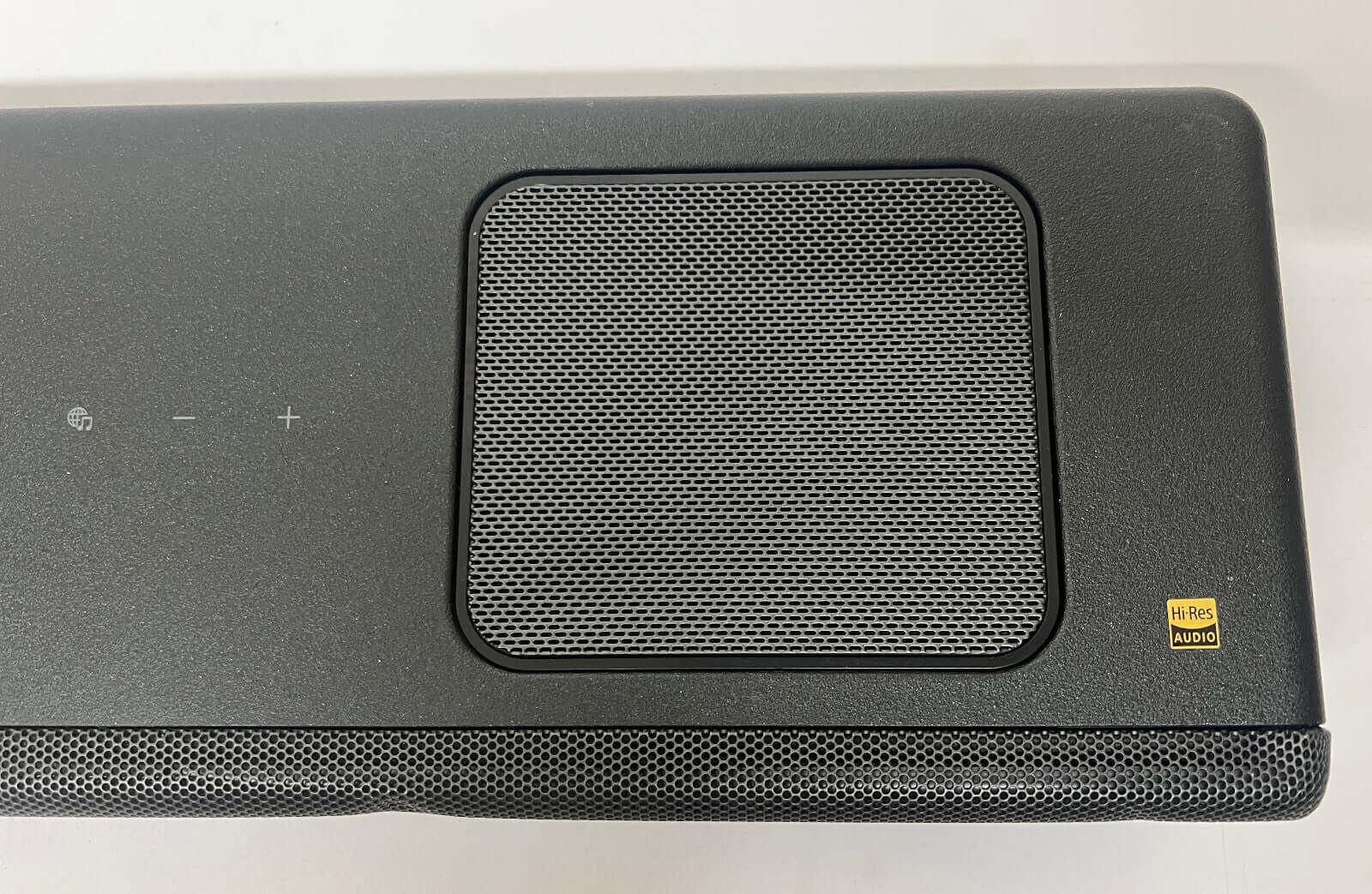 Close-up view of SONY HT-A5000 soundbar top with controls and speaker grille.