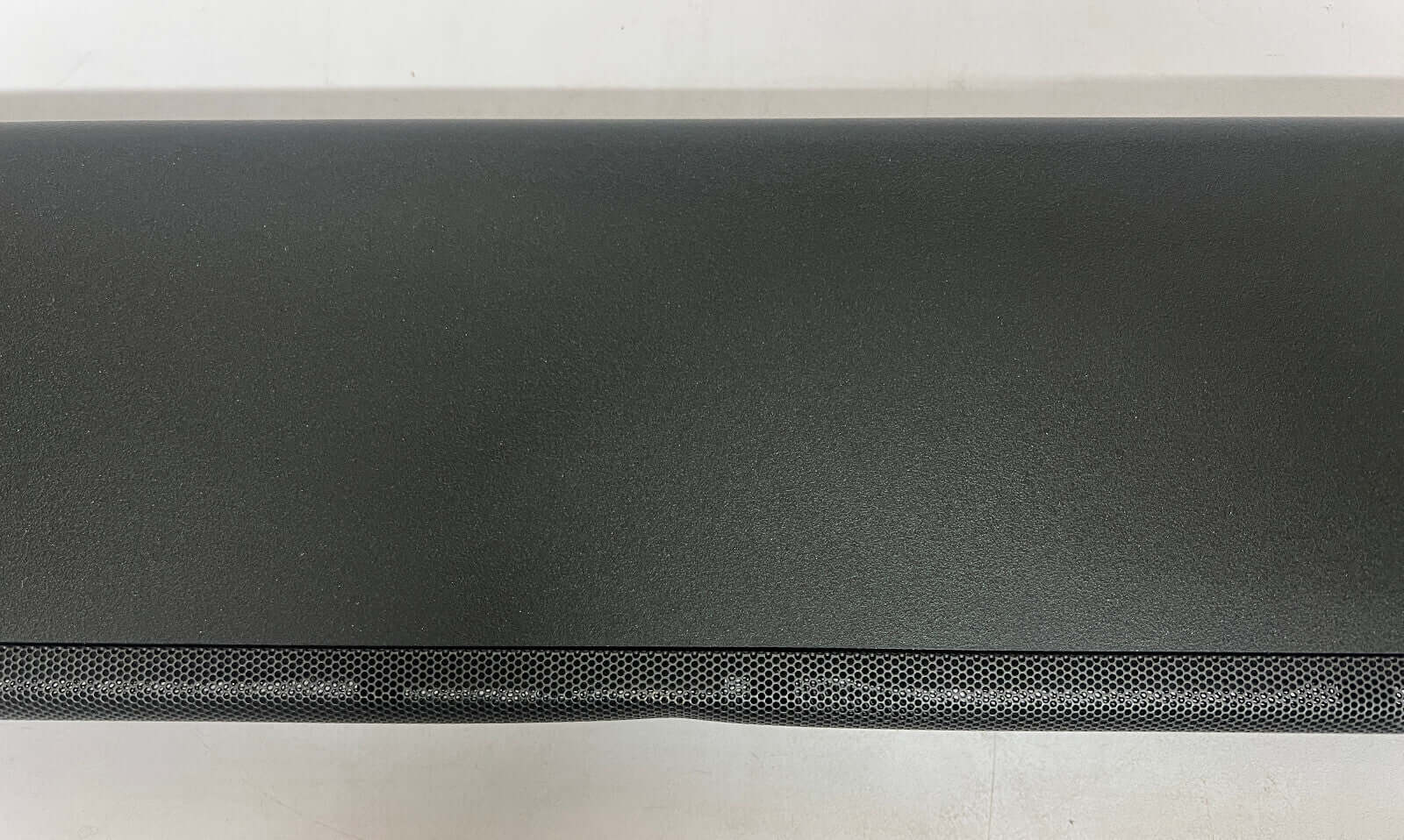 Top view of SONY HT-A5000 soundbar, featuring sleek design and perforated speaker grille.