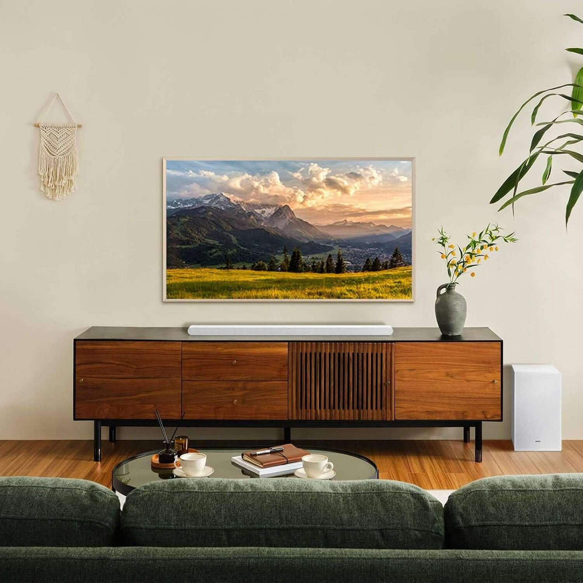 Living room featuring SAMSUNG HW-S701D wireless soundbar on a modern entertainment unit with mountain landscape artwork.