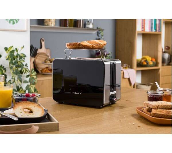 BOSCH SKY TAT7203GB 2 SLICE MODERN TOASTER 1050W STAINLESS STEEL BLACK with toast on warming rack.