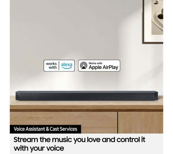 SAMSUNG HW-Q700C soundbar showcasing voice control features with Alexa and Apple AirPlay in a modern setting.