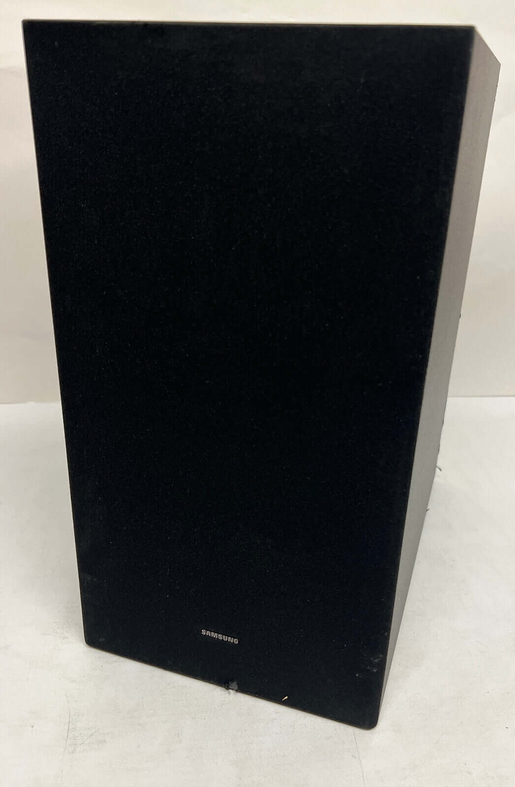 SAMSUNG HW-Q60C/XU wireless subwoofer, sleek black design, optimized for Dolby Atmos sound experience.