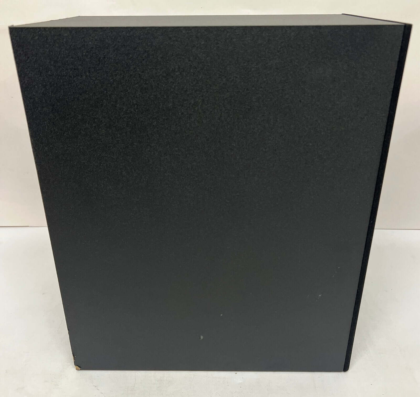 SAMSUNG HW-Q60C/XU wireless subwoofer showing black exterior and sleek design.