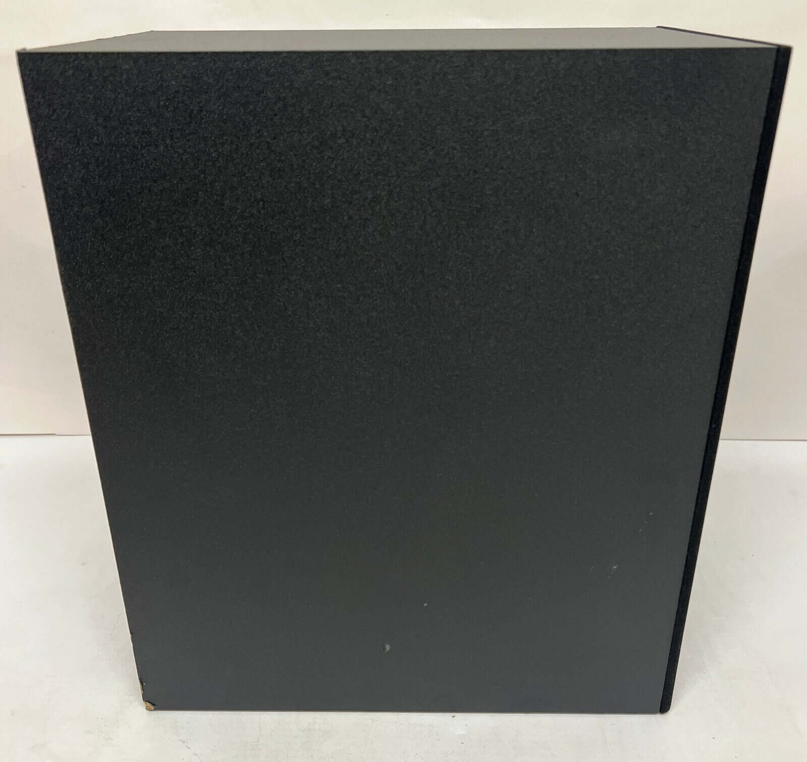 SAMSUNG HW-Q60C/XU wireless subwoofer showing black exterior and sleek design.