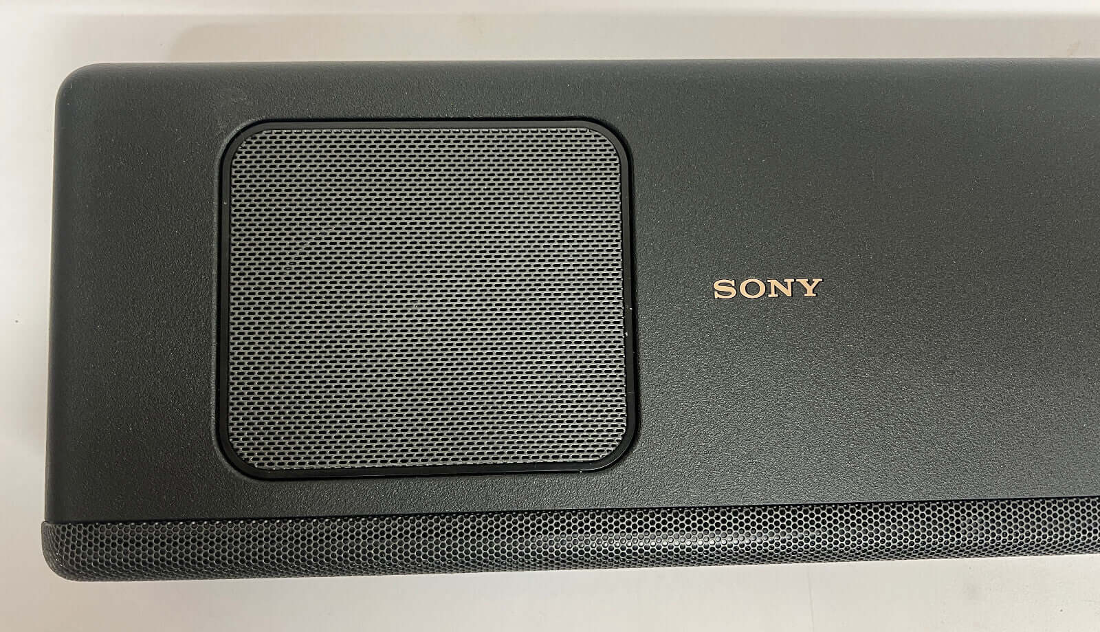 Top view of Sony HT-A5000 soundbar showcasing the speaker grill and brand logo.