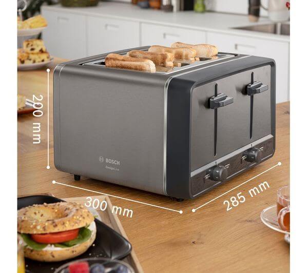 BOSCH DesignLine ERGO TAT5P445GB 4 SLICE TOASTER 980W STAINLESS STEEL ANTHRACITE on kitchen counter with toast.