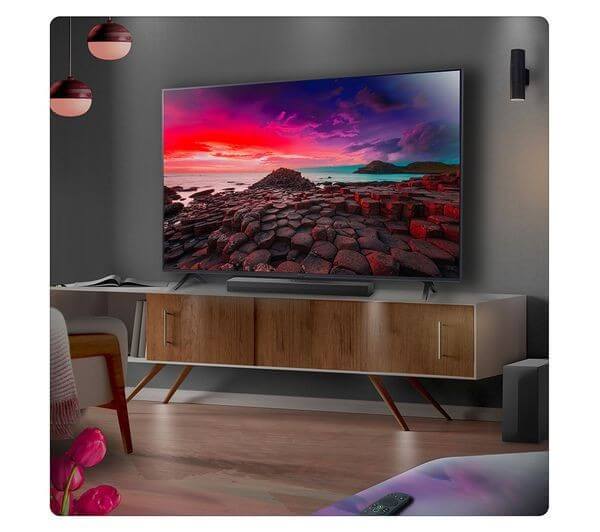 LG US60TR SOUNDBAR 5.1 440W WIRELESS SUBWOOFER BLUETOOTH HDMI USB AI SOUND PRO displayed under a modern TV.